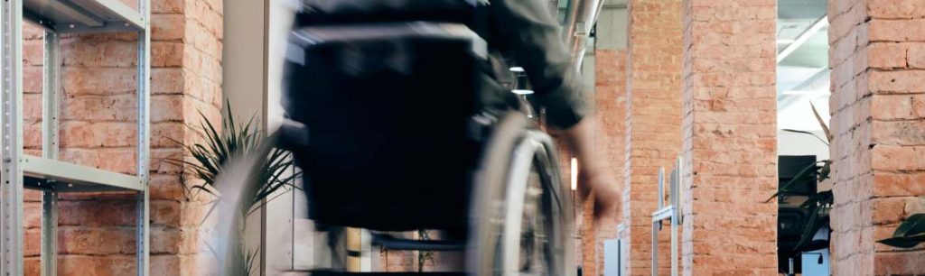 person-self-propelling-in-their-wheelchair