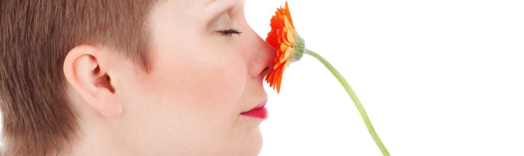 adult lady smelling a flower Assessment Types