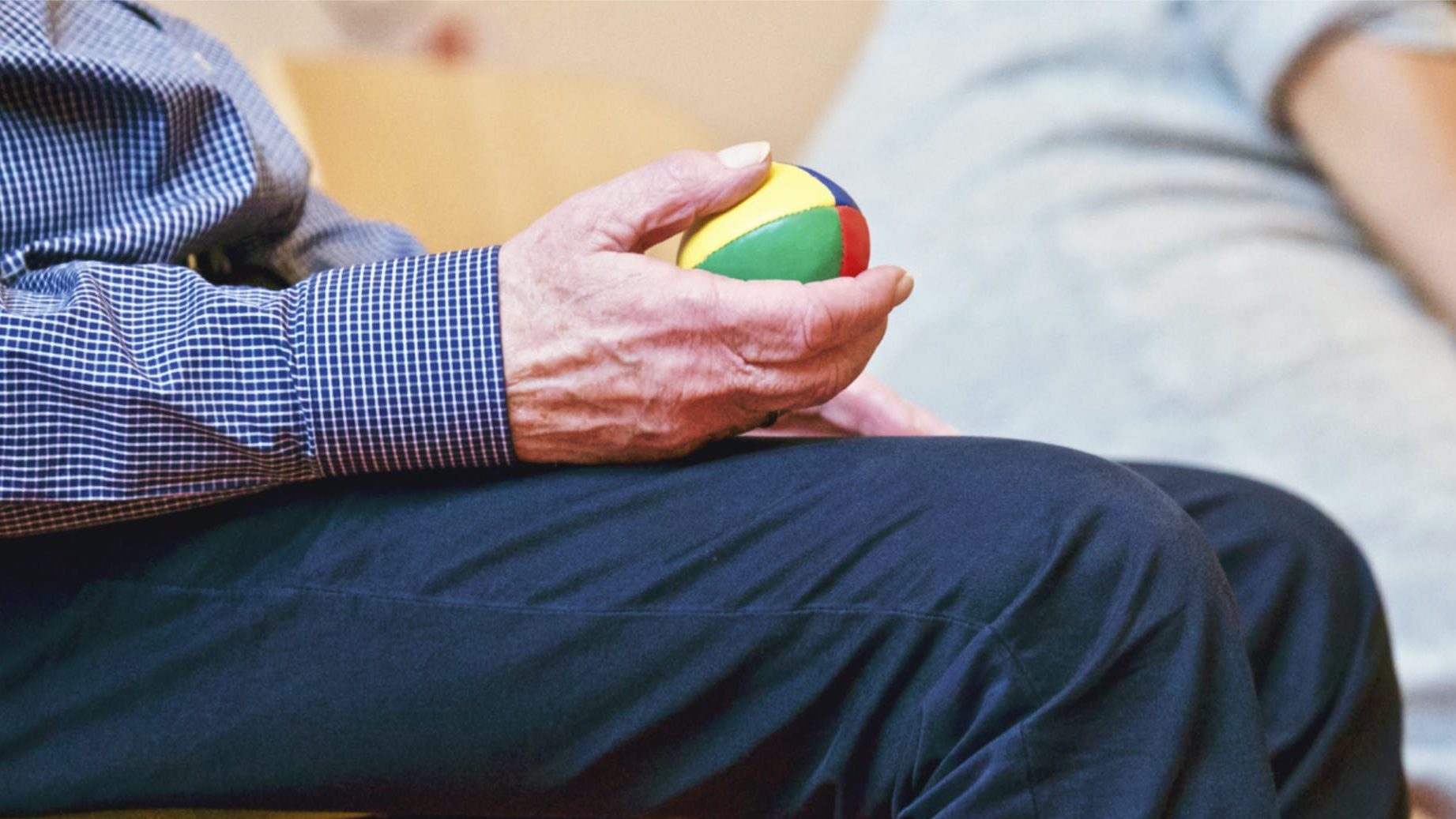 Person Holding Multicolored Ball. sensory needs assessment.