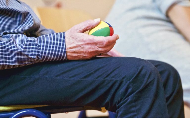 Occupational Therapy in Truro Cornwall Adult squeezing a Ball to improve his hand strength. Adult Private occupational therapy services in Cornwall and Devon