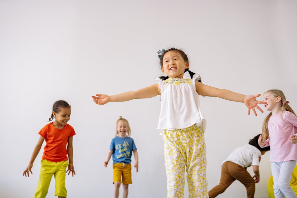 Girl in White and Yellow Floral Dress Playing With Other Kids. Easi sensory assessment, truro, cornwall