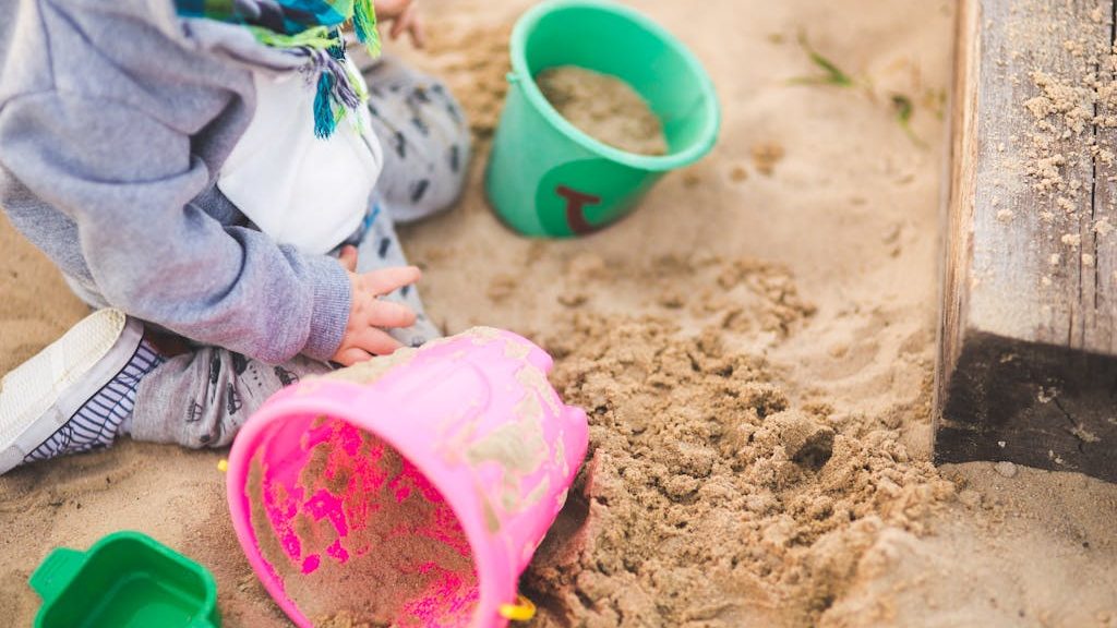 Little boy playing in the sand