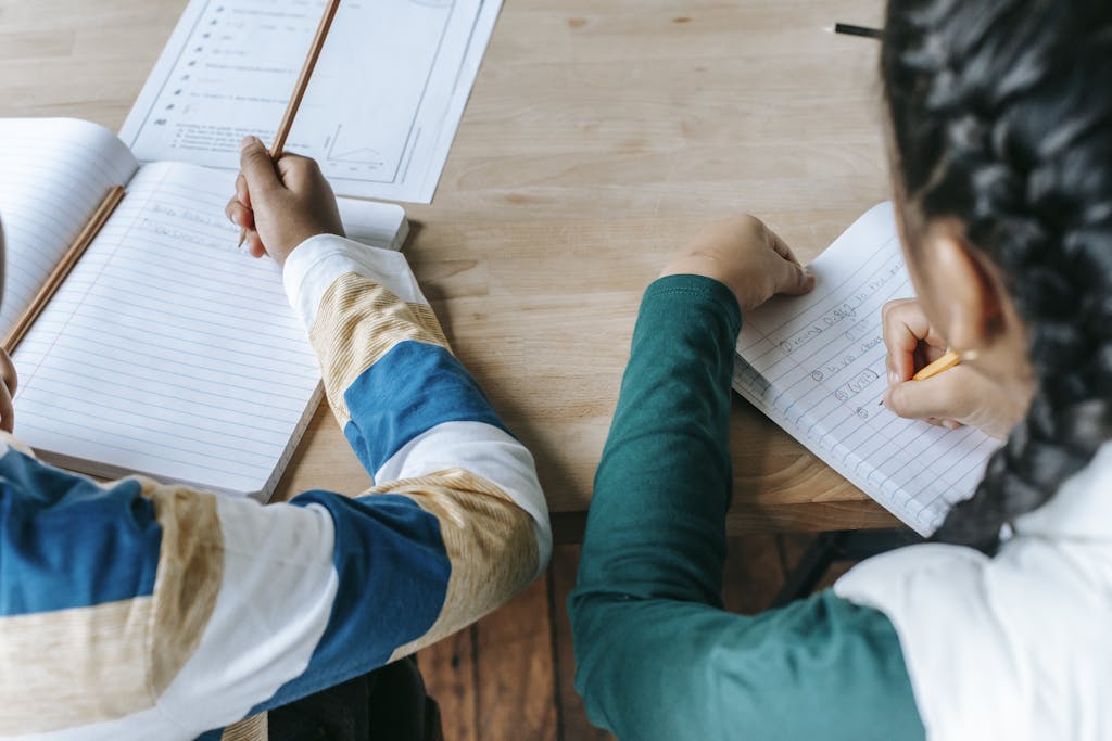 A children’s occupational therapist working with a child on handwriting skills. DASH Handwriting Assessment for Access Arrangements