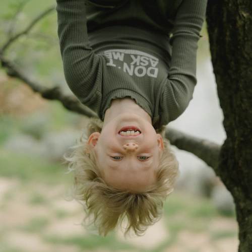 boy hanging upside down