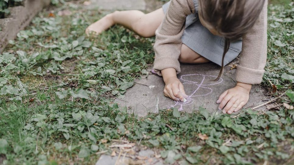 DASH handwriting assessment. child drawing with chalk on floor